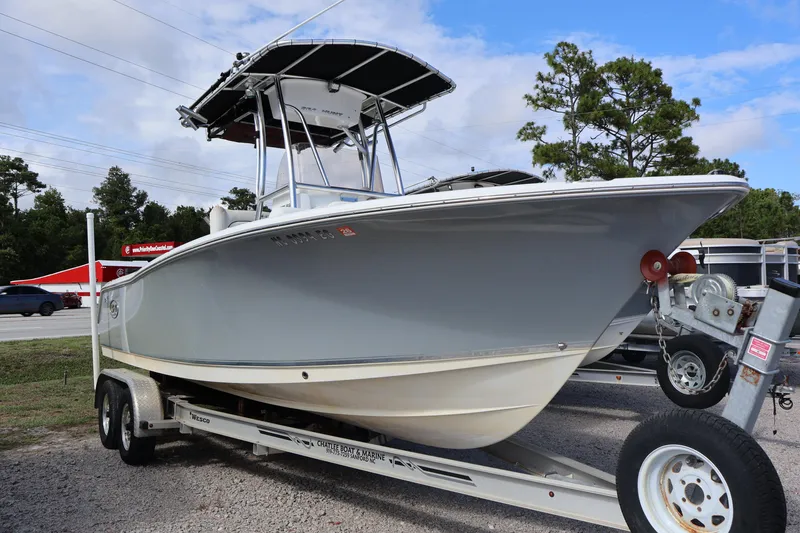 Slide: The Image of 2017 Sea Hunt 234 Ultra boat on a trailer in a parking lot. - 1