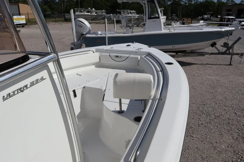 Slide: The Image of 2017 Sea Hunt 234 Ultra boat interior with seating and storage compartments. - 12
