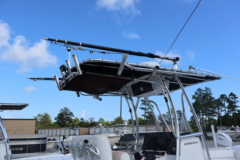 Slide: The Image of 2017 Sea Hunt 234 Ultra boat with fishing rod holders and T-top. - 3