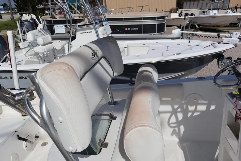 Slide: The Image of 2017 Sea Hunt 234 Ultra boat interior with seating and control console. - 7
