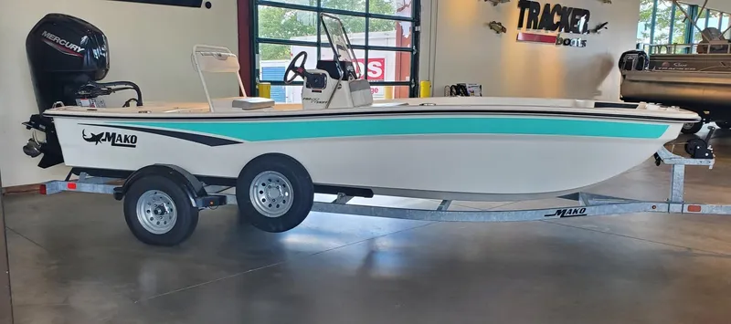 Slide: The Image of 2023 Mako Pro Skiff 17 CC boat on trailer in showroom. - 0