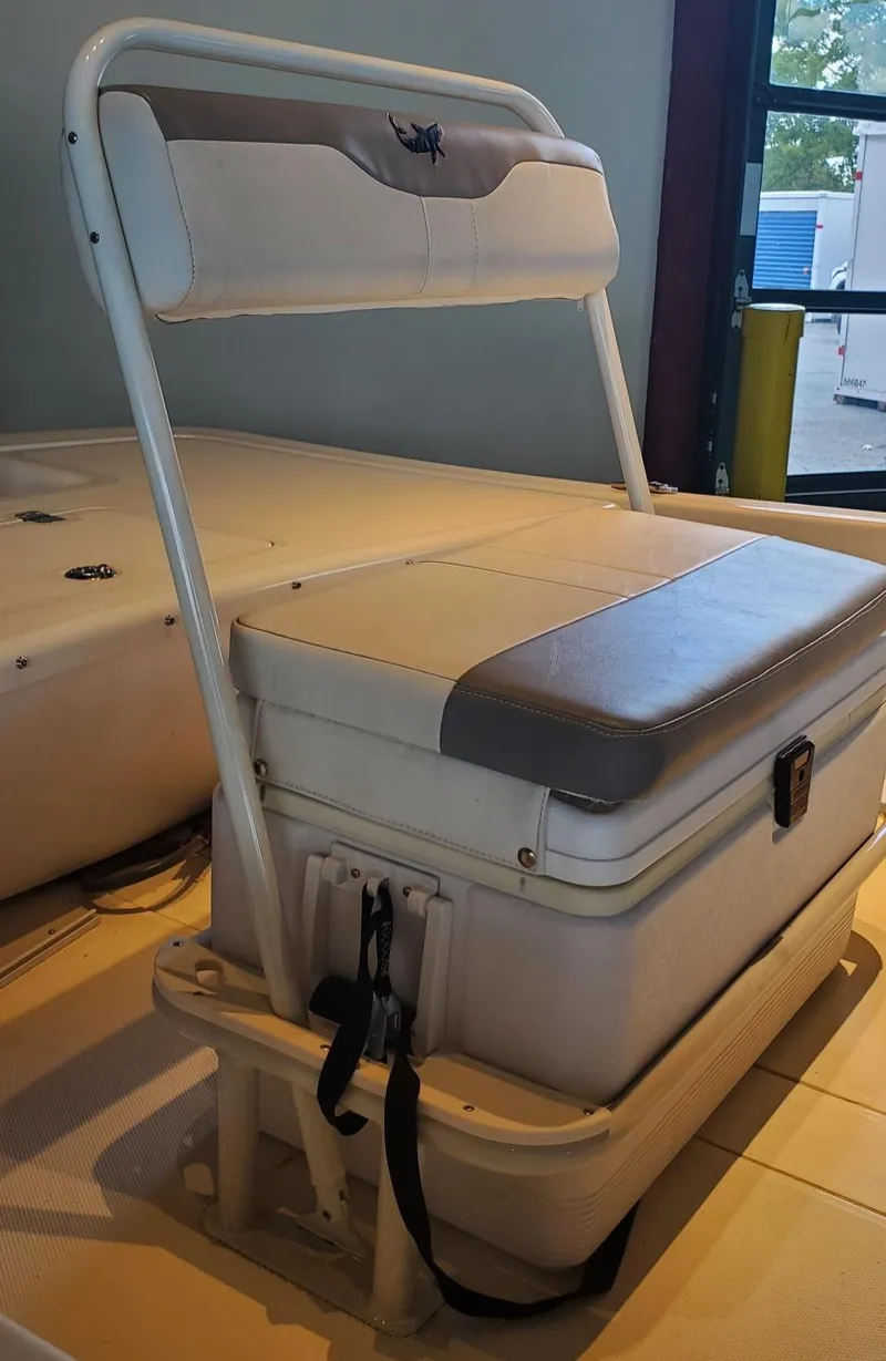 Slide: The Image of 2023 Mako Pro Skiff 17 CC boat seat with integrated storage. - 4