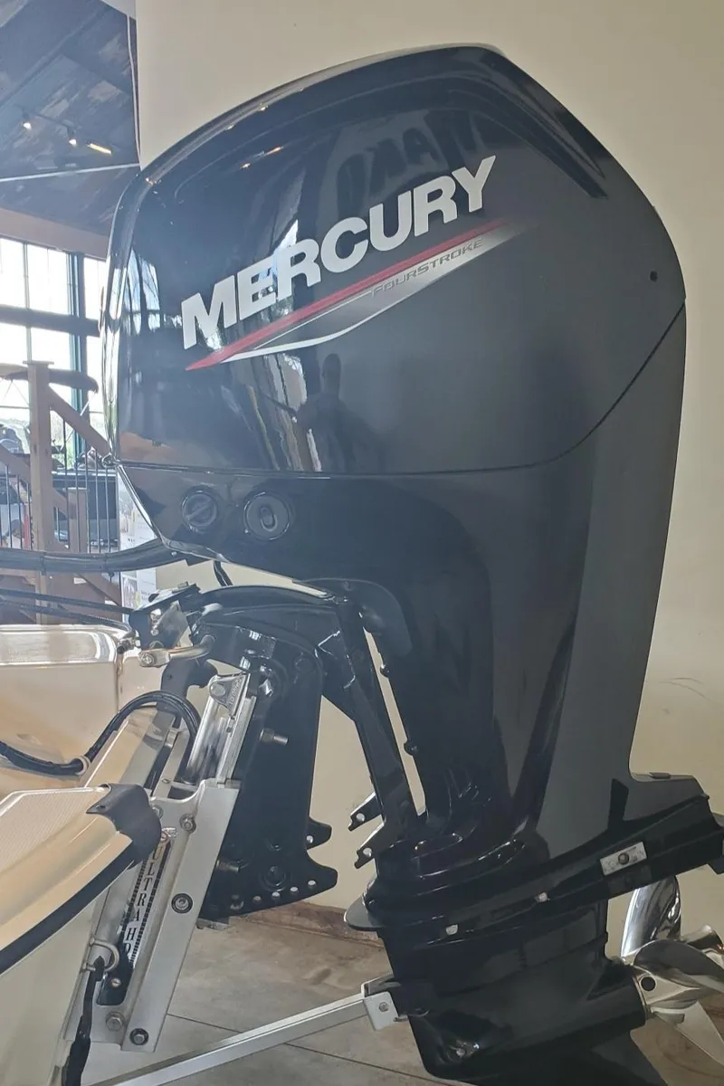 Slide: The Image of 2023 Mako Pro Skiff 17 CC with Mercury outboard motor. - 7