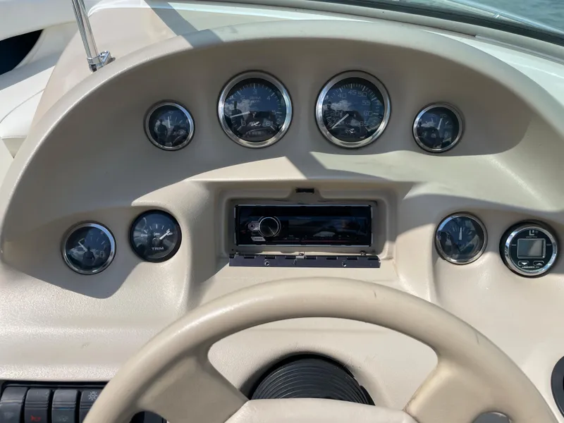 Slide: The Image of Dashboard of 1997 Sea Ray 190 SIGNATURE boat with gauges and steering wheel. - 11