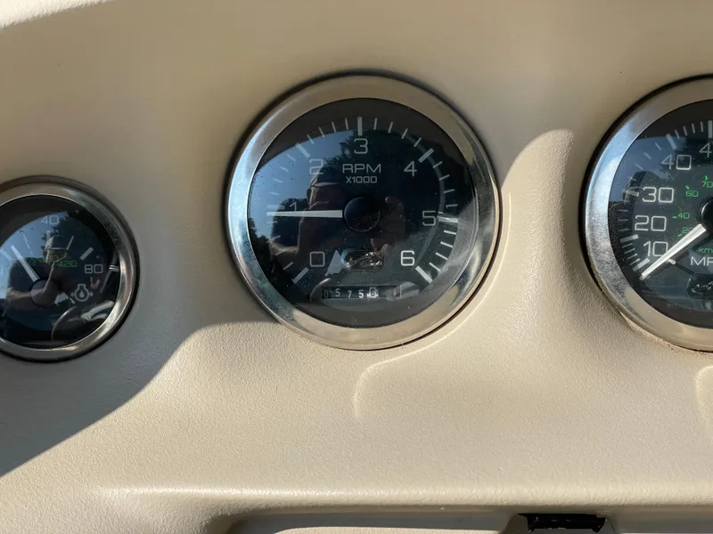 Slide: The Image of Close-up of 1997 Sea Ray 190 Signature boat dashboard gauges. - 12