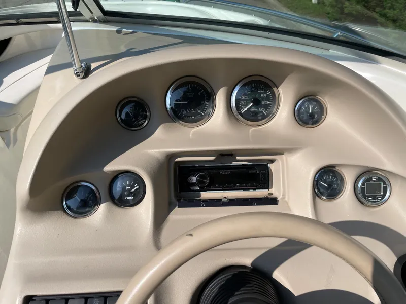 Slide: The Image of Dashboard of a 1997 Sea Ray 190 SIGNATURE boat with gauges and controls. - 13