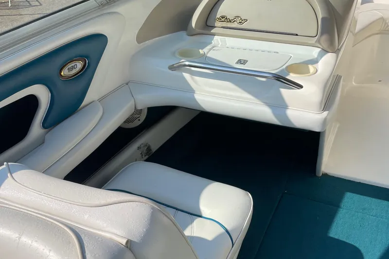 Slide: The Image of Interior of 1997 Sea Ray 190 SIGNATURE boat with white and blue seating. - 17