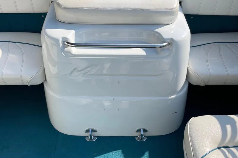 Slide: The Image of Interior of 1997 Sea Ray 190 Signature boat with white seating and teal carpet. - 19