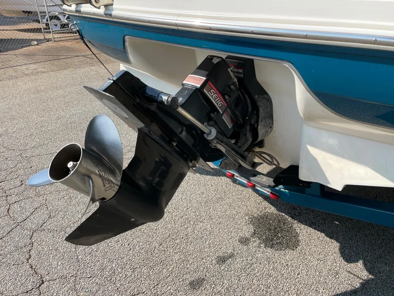Slide: The Image of 1997 Sea Ray 190 Signature boat with visible propeller and outdrive. - 22