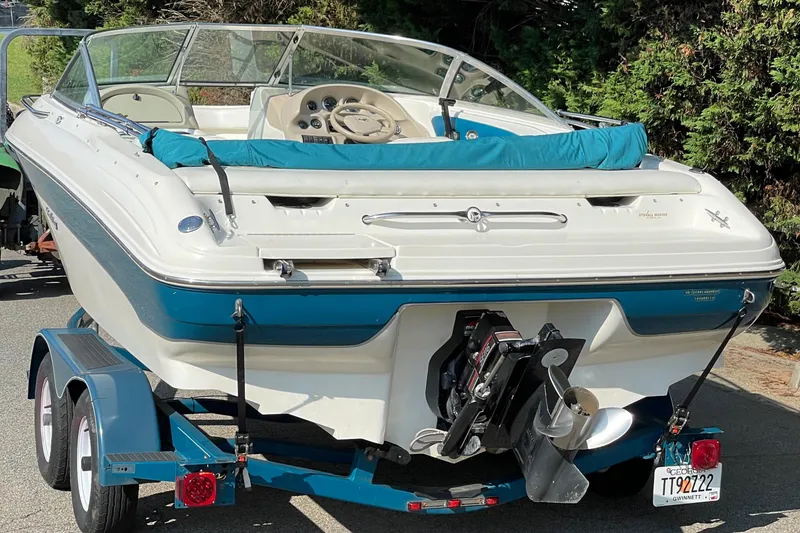 Slide: The Image of 1997 Sea Ray 190 Signature boat on trailer, rear view, white and blue design. - 5