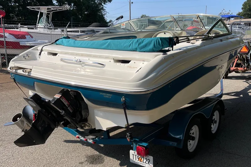 Slide: The Image of 1997 Sea Ray 190 Signature boat on trailer, parked outdoors. - 6