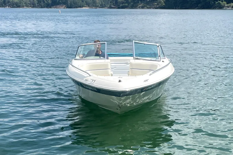 Slide: The Image of 1997 Sea Ray 190 SIGNATURE boat on a calm lake. - 9