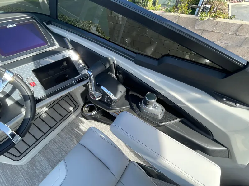 Slide: The Image of 2025 Avalon 2785 Excalibur Elite dashboard with modern controls and carbon fiber accents. - 10