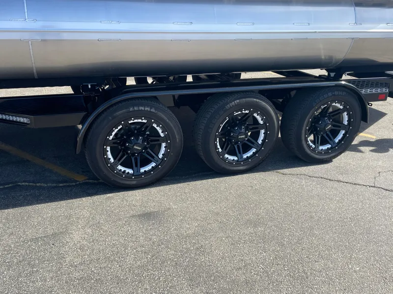 Slide: The Image of 2025 Avalon 2785 Excalibur Elite-Carbon Fiber trailer with sleek black wheels. - 3