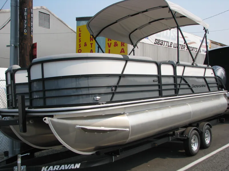 Slide: The Image of 2023 Berkshire 22CL2 CTS pontoon boat on a Karavan trailer. - 2