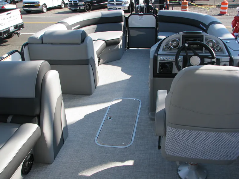 Slide: The Image of 2023 Berkshire 22CL2 CTS pontoon boat interior with gray seating and modern dashboard. - 3