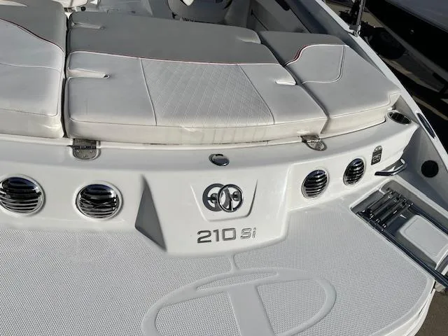 Slide: The Image of 2023 Tahoe 210 Si boat interior with white seating and sleek design. - 2