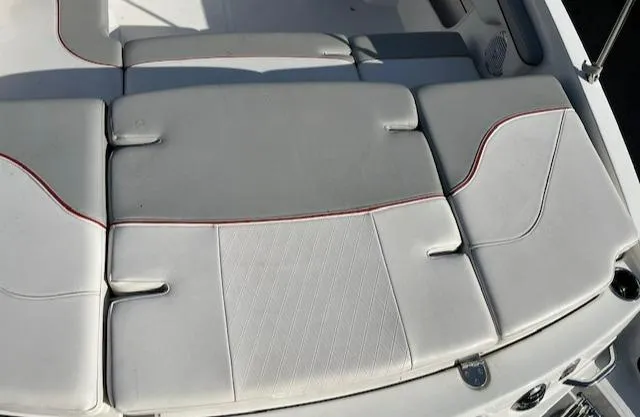 Slide: The Image of 2023 Tahoe 210 Si boat seating with white upholstery and red accents. - 4