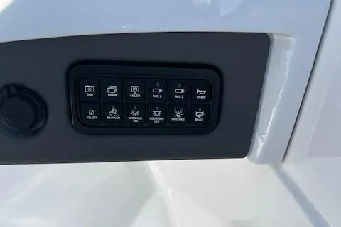 Slide: The Image of Control panel of 2023 Tahoe 210 Si boat with various function buttons. - 8