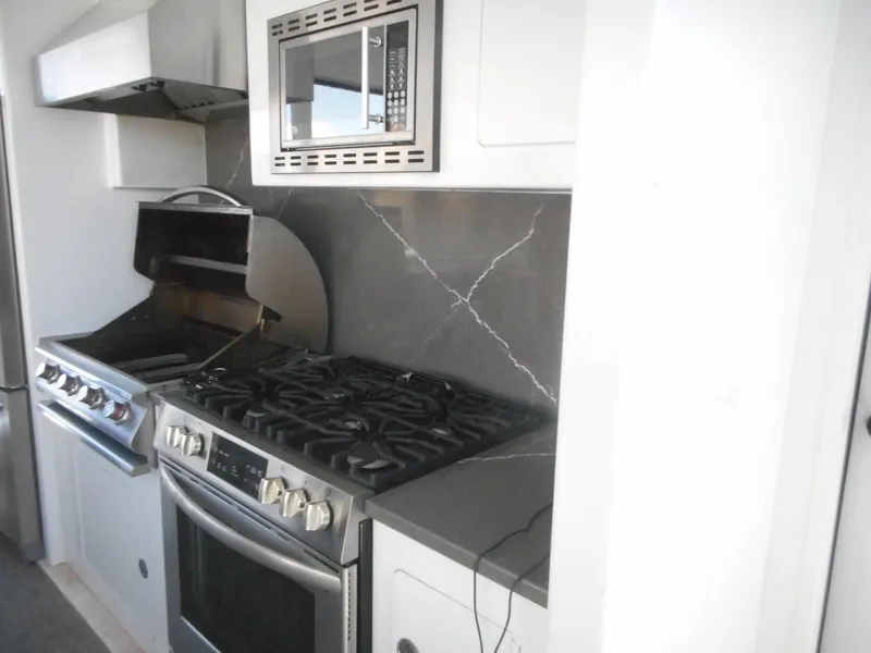 Slide: The Image of Modern kitchen with stainless steel appliances in Adonia Obsession Trip #12, 2021 model. - 12