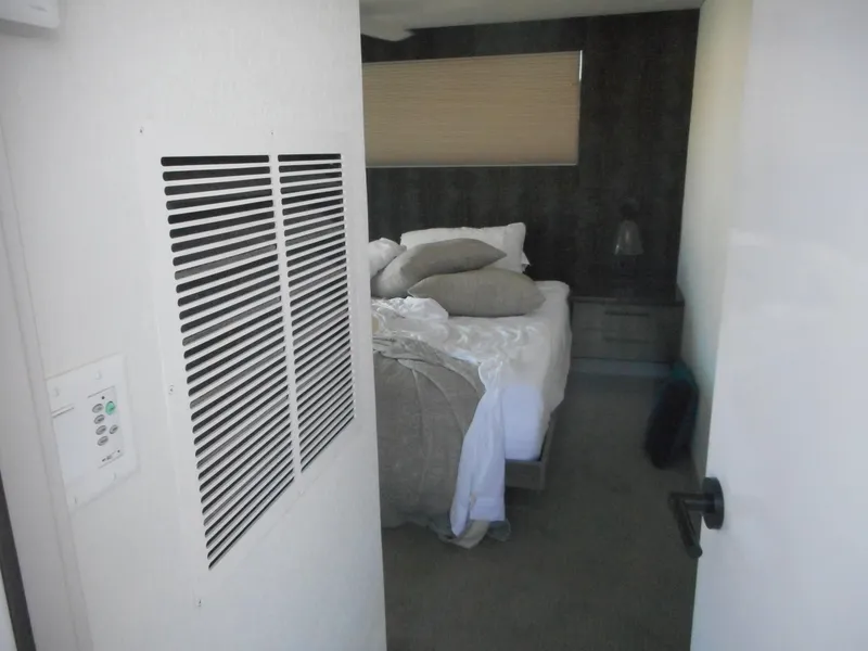 Slide: The Image of Cozy bedroom with unmade bed, neutral tones, and modern decor in Adonia Obsession Trip #12, 2021. - 15