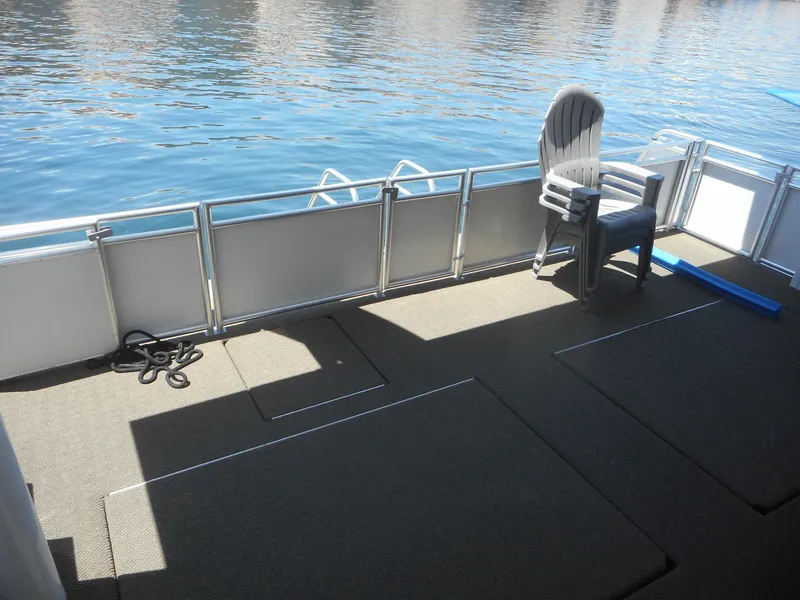 Slide: The Image of Deck of Adonia Obsession Trip #12 houseboat, 2021 model, with chair and water view. - 20