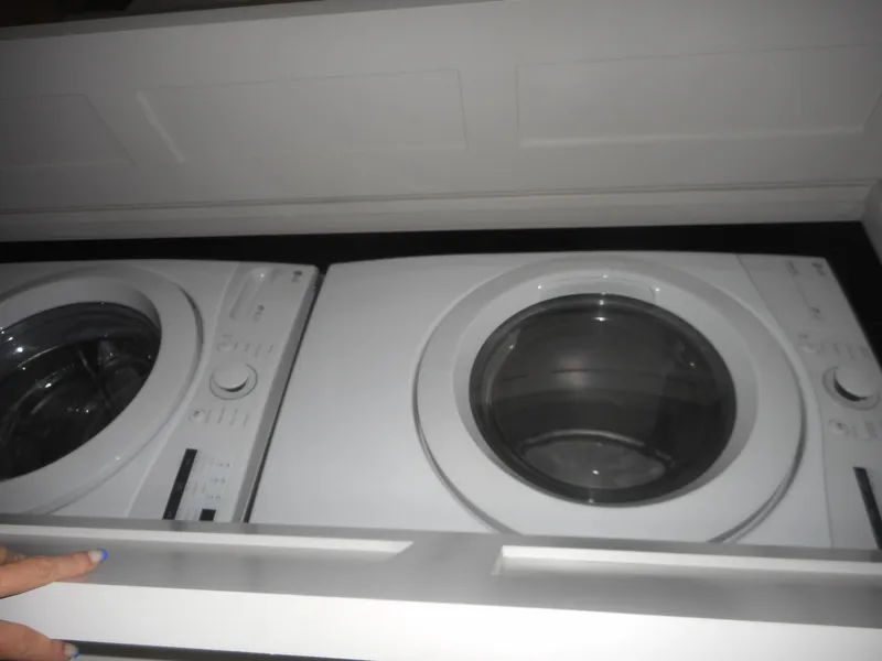 Slide: The Image of Front-loading washing machines in a laundry room, Adonia Obsession Trip #12, 2021 model. - 36
