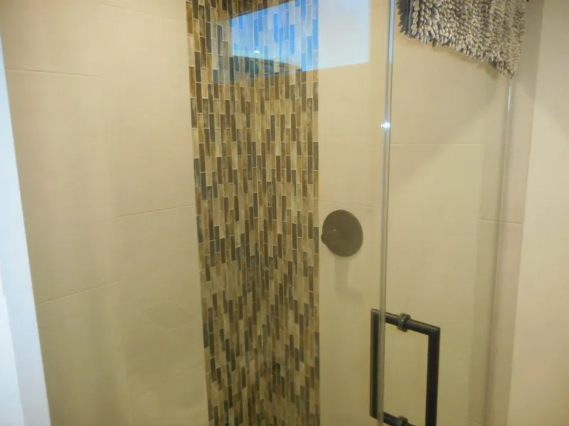 Slide: The Image of Modern shower with glass door and mosaic tile design, Adonia Obsession Trip #12, 2021. - 39