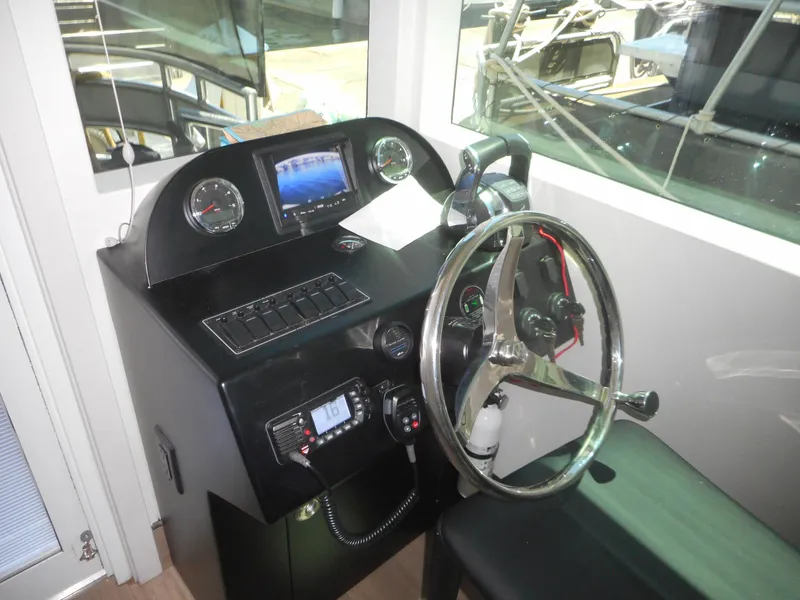 Slide: The Image of Control panel of Adonia Obsession Trip #12, 2021 model, featuring steering wheel and gauges. - 44