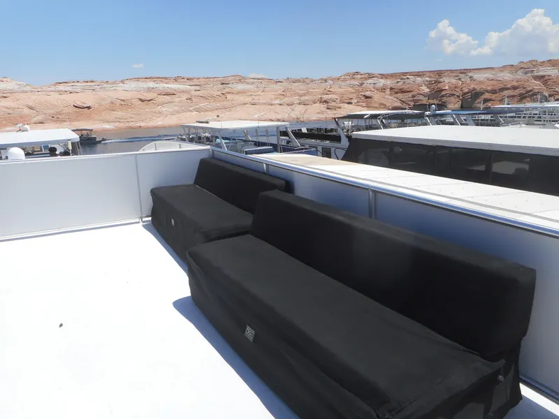 Slide: The Image of Rooftop deck of Adonia Obsession Trip #12 houseboat, featuring black seating, 2021 model. - 7