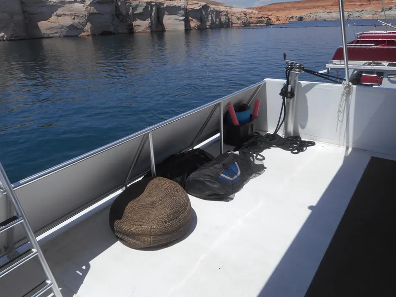 Slide: The Image of Boat deck with equipment, calm water, and rocky shoreline; Adonia Obsession Trip #12, 2021. - 9