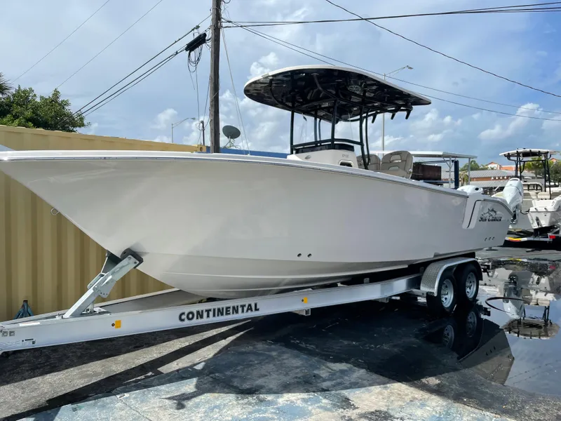 Slide: The Image of 2023 Sea Chaser 27 HFC boat on Continental trailer in outdoor setting. - 1