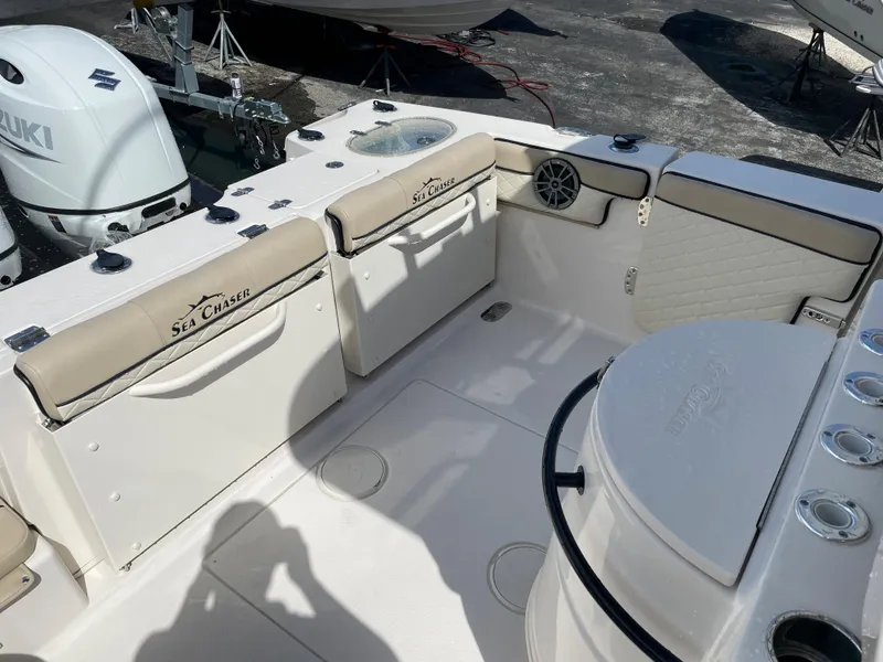 Slide: The Image of 2023 Sea Chaser 27 HFC boat interior with seating and storage compartments. - 12