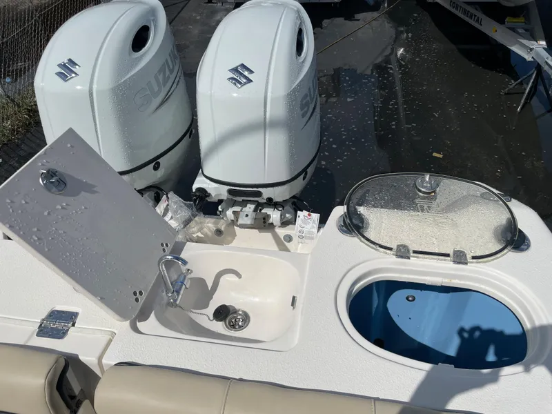 Slide: The Image of 2023 Sea Chaser 27 HFC boat with dual Suzuki outboard engines, sink, and livewell. - 14