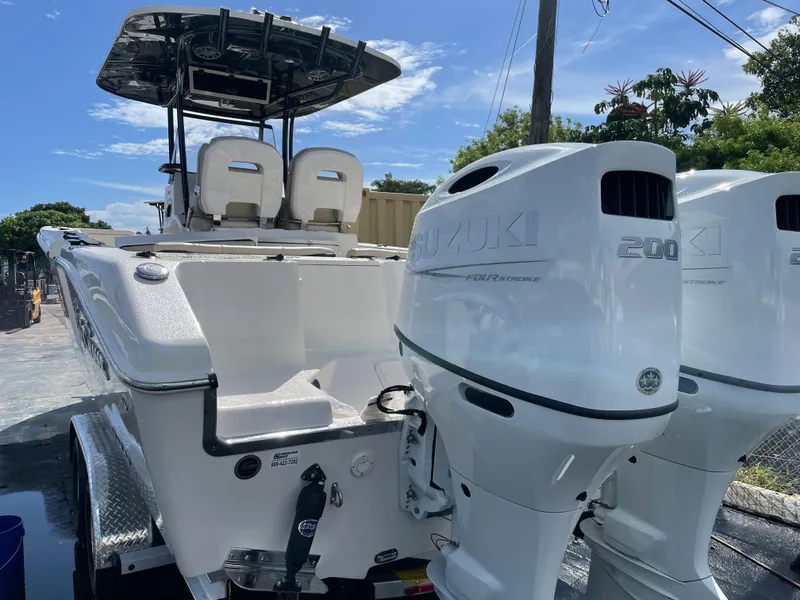 Slide: The Image of 2023 Sea Chaser 27 HFC boat with dual Suzuki 200 outboard engines. - 16