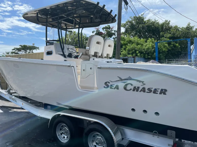 Slide: The Image of 2023 Sea Chaser 27 HFC boat on a trailer, side view. - 2