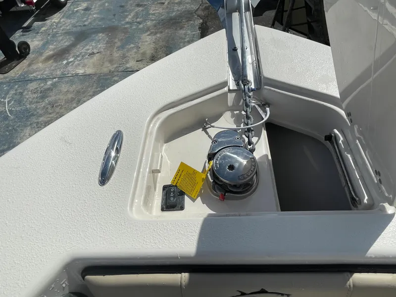 Slide: The Image of 2023 Sea Chaser 27 HFC boat anchor compartment with winch and storage. - 5
