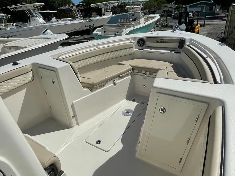 Slide: The Image of 2023 Sea Chaser 27 HFC boat interior with cushioned seating and storage compartments. - 6
