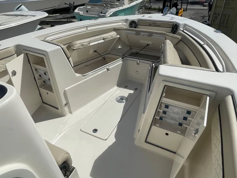 Slide: The Image of 2023 Sea Chaser 27 HFC boat interior with seating and storage compartments. - 7