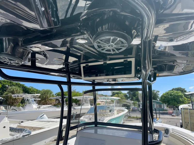 Slide: The Image of 2023 Sea Chaser 27 HFC boat interior with overhead speakers and console. - 9