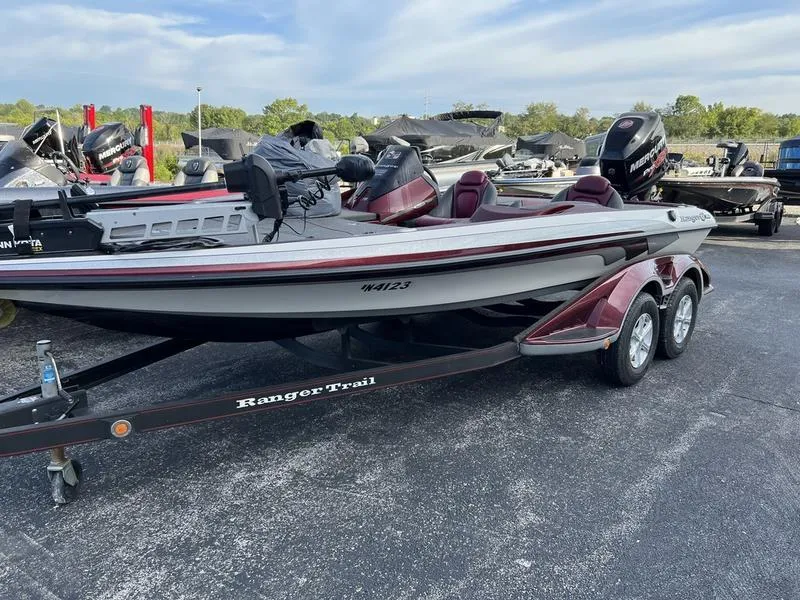 Slide: The Image of 2013 Ranger Z119c bass boat on Ranger Trail trailer in parking lot. - 1