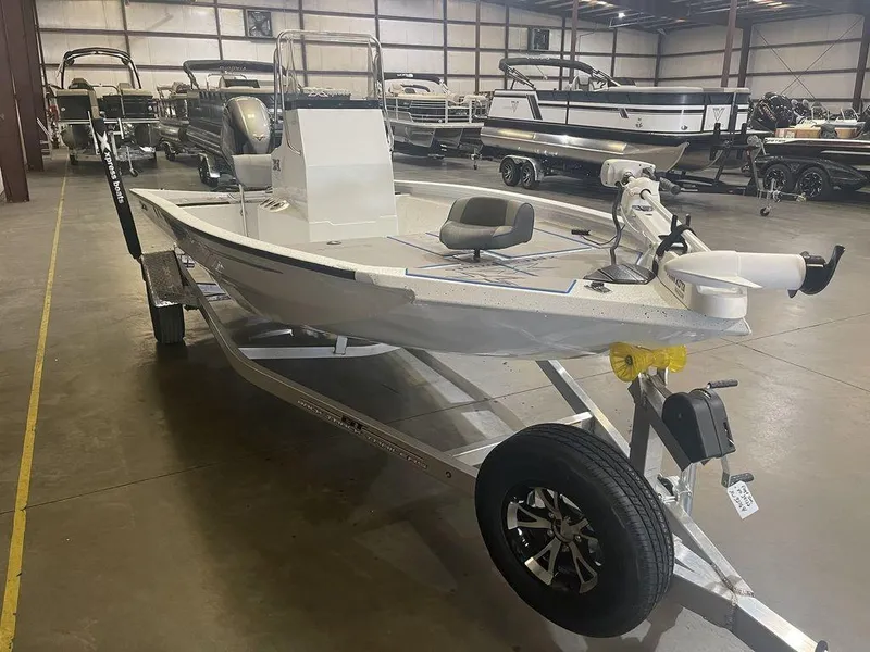 Slide: The Image of 2023 Xpress H190B boat on trailer in indoor showroom. - 16