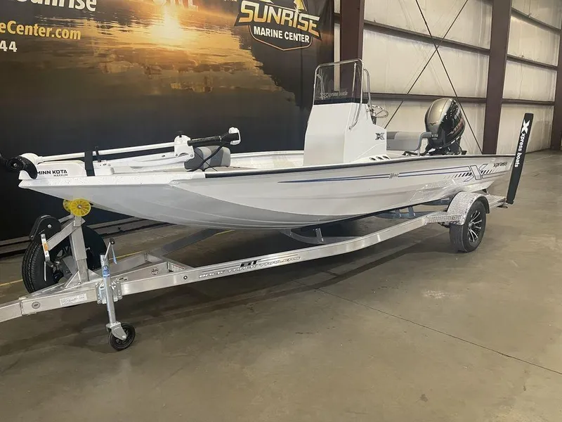 Slide: The Image of 2023 Xpress H190B boat on a trailer in a showroom. - 22