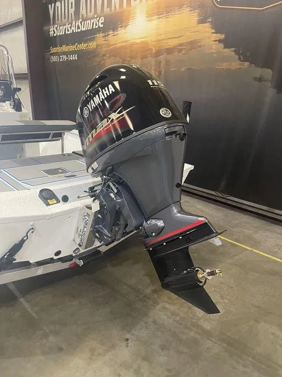 Slide: The Image of 2023 Xpress H190B boat with Yamaha outboard motor in showroom. - 4