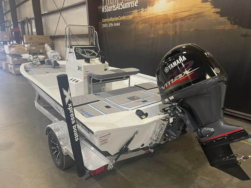 Slide: The Image of 2023 Xpress H190B boat with Yamaha engine in showroom. - 5