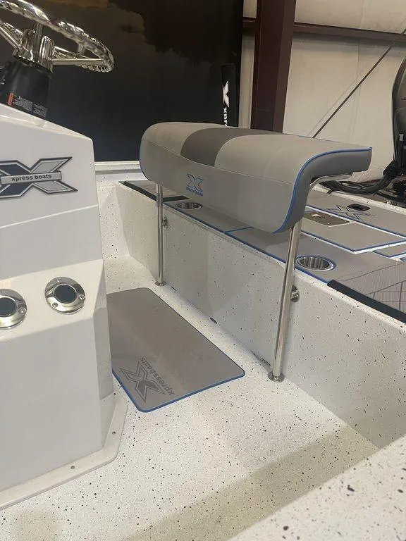 Slide: The Image of 2023 Xpress H190B boat interior with seating and console. - 7