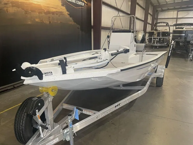 Slide: The Image of 2023 Xpress H190B boat on trailer in indoor showroom. - 9