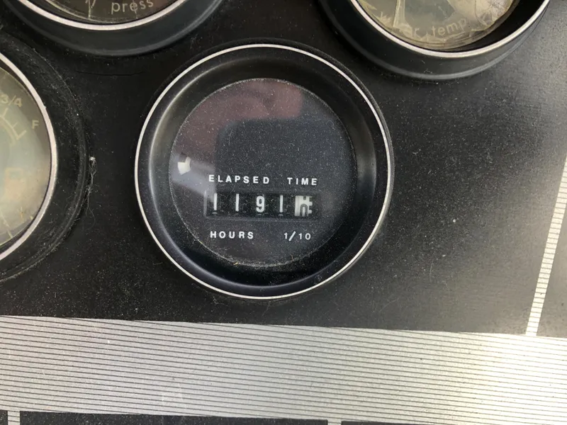 Slide: The Image of Elapsed time gauge on 1986 Cruisers ESPRIT 3370 showing 1191.6 hours. - 6