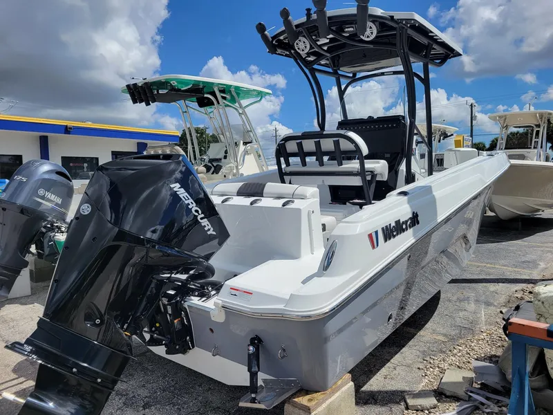 Slide: The Image of 2023 Wellcraft 222 Fisherman boat with Mercury outboard motor. - 1