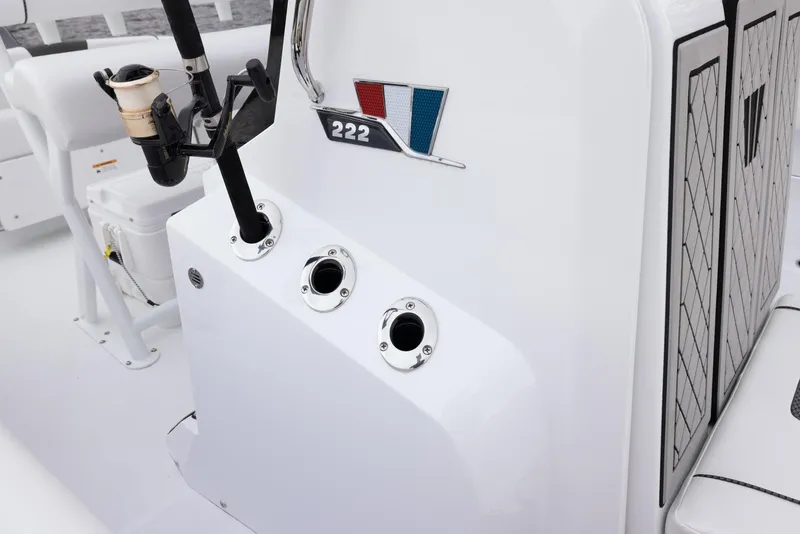 Slide: The Image of 2023 Wellcraft 222 Fisherman boat console with rod holders and seating. - 15